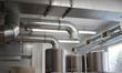 Ventilation pipe system in kitchen interior.