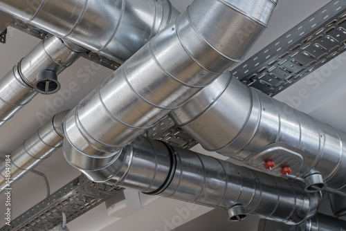 Fotomural Ventilation pipe system in kitchen interior.