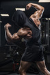 © romanolebedev - Brutal strong athletic men pumping up muscles workout bodybuilding concept background - muscular bodybuilder handsome men doing exercises in gym