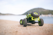 Radio-controlled Car On The Sand. Close Up