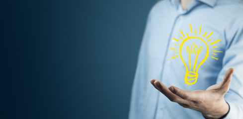 Canvas Print - man touching e light bulb on screen