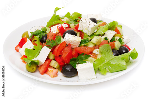 Fotografie, Obraz Greek Salad (Feta Cheese, Olive and Vegetables) isolated on white background