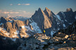 © Jeff Carlson - Man standing on edge of mountain looking out over mountain range