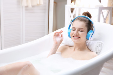 Canvas Print - Beautiful young woman taking bath at home