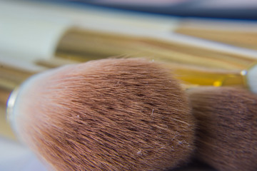 Close up of brushes, makeup applicators.