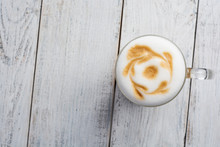 latte macchiato coffee on white wooden background. Top view