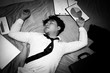 © Jestercine - Asian businessman is deep sleeping in his bed at night, black and white color tone.