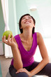 © digitalskillet1 - Healthy Asian woman eating an apple.