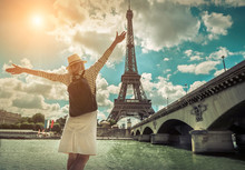 Woman Tourist Selfie Near The Eiffel Tower In Paris Under Sunlig