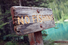 No Fishing Sign By A Lake