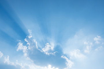 Wall Mural - sun rays behind clouds