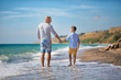 © TwinkleStudio - Father and son playing on the beach at the day time. Concept of friendly family.