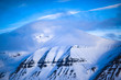 Winter mountain nature Svalbard Longyearbyen Svalbard Norway with blue sky and snowy peaks and blue sky on a sunny day with clouds wallpaper