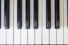 Close-up Of Piano Keys. Close Frontal View.