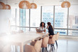 © Monkey Business - Two Businesswomen Using Laptop In Boardroom Meeting