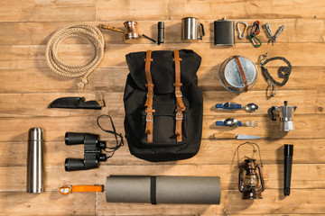 Traveler set on wooden background, flat lay