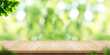 Empty Wood Plank Table Top With Blur Park Green Nature Background Bokeh Light,Mock Up For Display Or Montage Of Product,Banner Or Header For Advertise On Social Media,Spring And Summer Concept