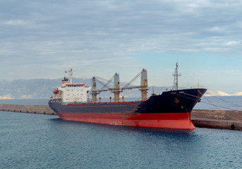 Wall Mural - Heraklion. A large dry-cargo ship at the pier.