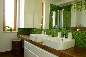 Interior of modern bathroom with double sink and mirror