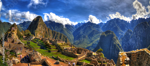 Zdjęcie: Colorful panoramic HDR image of Machu Picchu, Peru, South America - the lost city of the Inca on blue sky. Machu Picchu is UNESCO World Heritage Site, and One of the New Seven Wonders of the World. Colorful panoramic HDR image of Machu Picchu, Peru, South America - the lost city of the Inca on blue sky. Machu Picchu is UNESCO World Heritage Site, and One of the New Seven Wonders of the World.