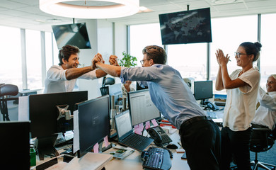 Wall Mural - Business people celebrating success in office