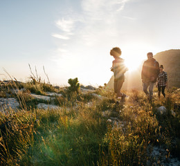 Young people walking through countryside