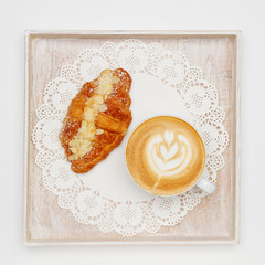 Wall Mural - cappuccino and croissant on a tray