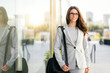 © elnariz - Pretty woman in business suit with bag stylish trendy with glasses and professional executive theme