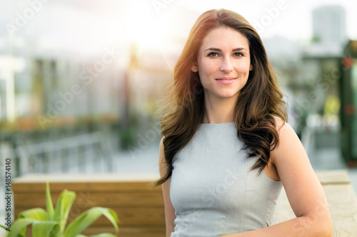 Fotografia, Obraz Attractive natural real estate woman outdoor on rooftop of new modern building e