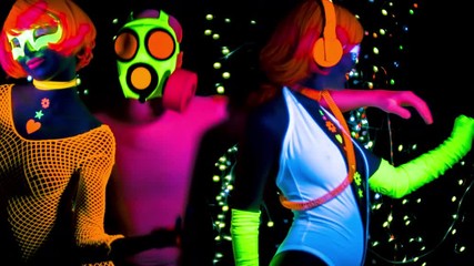 Poster - two female gogo ravers in fluorescent costume dancing with masked man in disco setting