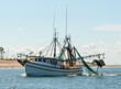 Shrimp trawler fishing boat in St George Island Florida Gulf of Mexico