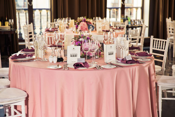 Wall Mural - Pink dinner table served with sparkling glasses and plates