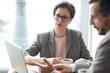 © pressmaster - Business experts analyzing financial data in the net