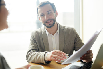 Businessman explaining terms of contract to potential partner