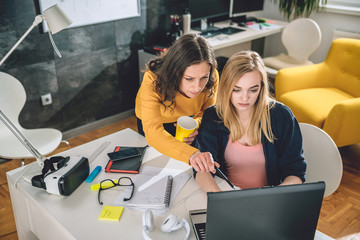two business woman working at the office