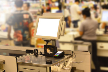 Point of Sale terminal at the shop or Payment with credit card for purchases with EDC machine or Payment technology in the departmentstore with blurred customer and cashier background with light