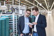 © Westend61 - Two men with tablet talking in factory shop floor