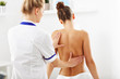 © Kalim - A picture of woman having back therapy
