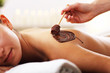 © Kalim - Beautiful woman getting chocolate massage in spa