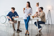 © LIGHTFIELD STUDIOS - front view of group of business people at workplace in modern office