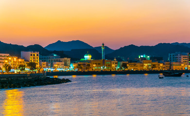 Wall Mural - View of coastline of Muttrah district of Muscat during sunset, Oman.