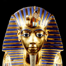 Replica Of Funerary Mask Of Tutankhamun. Isolated On Black Background. The Same Or Very Similar To The Original