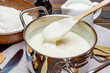 © Anatoly Repin - bechamel sauce in a pan and ingredients
