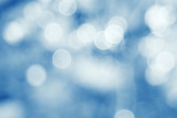 Fototapeta Kosmos - silvery blue highlights snow rain water blurred background