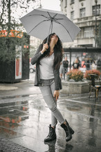 Happy Smiling Woman Under Umbrella In Rain