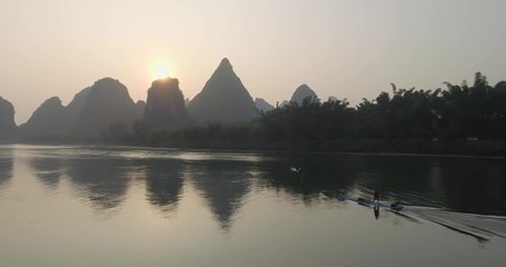 Wall Mural - Aerial view of sunrise over landscape of Yangshuo, Guanxi province, Guilin City, China. Li River and karst mountains top view. Travel, adventure and picturesque famous destination concept.