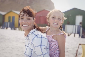 Wall Mural - Portrait of smiling woman with daughter