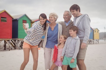 Wall Mural - Cheerful multi-generation family taking selfie