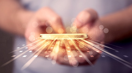 Aufkleber - Person holding smarthphone with technology light applications
