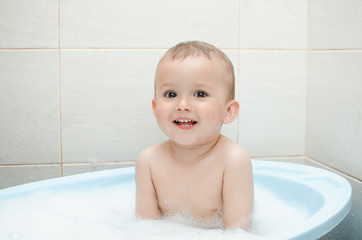 Wall Mural - Happy baby boy taking a bath